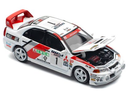 Pop Race - Mitsubishi Lancer Evolution IV RHD #1 Tommi Makinen / Seppo Harjanne Rally de Catalunya 1997 Winner 1/64 - Multicolor (PR64-165)